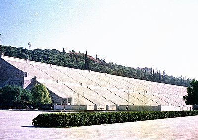 Panoramic view of the **Panathenaic Stadium (Kallimarmaro)**, Athens, Greece, showcasing its iconic marble seating and runnin...