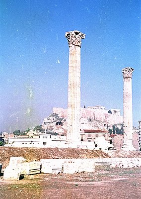 Ancient Greek-style columns with Corinthian capitals standing on a rocky hillside, likely part of the Roman Agora in Athens, ...