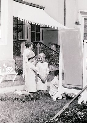 Vintage black-and-white photo of three women in 1960s-era attire—striped dresses, sunglasses, and hairstyles—posing outdoors ...