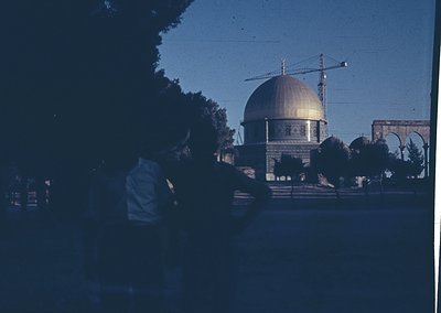 Vintage black-and-white photo of Dome of the Rock in Jerusalem, featuring its iconic golden dome and intricate geometric patt...