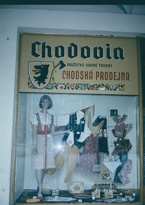 Vintage storefront sign for **Chodovin** (Czech: *Družstvo lidové tvorby Chodská prodejna*), a cooperative folk art shop from...