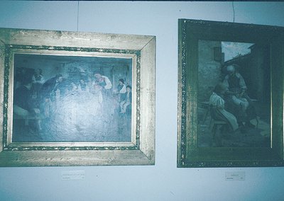 Vintage framed paintings depicting rural life scenes, likely from the 19th–early 20th century. Left: Group of people gathered...