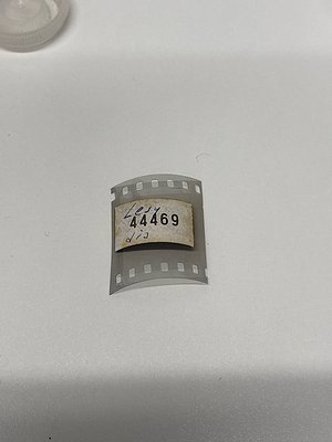 Vintage 35mm film leader strip with serial , perforated edges intact. Likely mid-20th century Kodak film stock. Useful for ar...