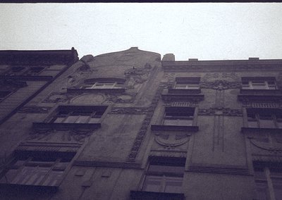 Art Deco-inspired façade featuring sculpted reliefs, geometric window frames, and decorative balconies. Likely mid-20th centu...
