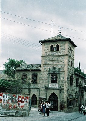 Historic stone tower with Gothic Revival details, likely a 19th-century landmark. The building features arched windows, decor...