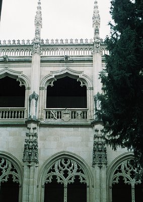 Gothic Revival façade featuring pointed arches, ornate tracery, and intricate stone carvings. Symmetrical design with decorat...