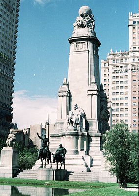 Neoclassical equestrian monument featuring two mounted figures atop a grand pedestal with sculpted reliefs, set in an urban p...