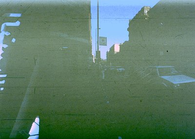 Vintage aerial view of urban infrastructure, likely a highway or overpass, with visible concrete barriers and road markings. ...