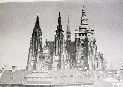 Gothic cathedral with intricate spires and towering façade, likely Wawel Cathedral in Kraków, Poland. Constructed in the 14th...