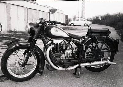 Classic Jawa motorcycle, likely a **Jawa 350cc** model, photographed in mid-20th century (1950s–1960s). Prominent sidecar-mou...