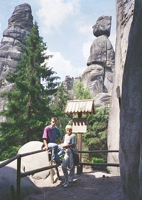 Two individuals pose on a wooden bridge near the famous **Bastei** rock formations in **Sächsische Schweiz National Park**, G...