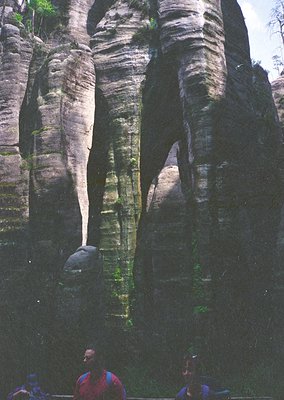 Striking vertical rock formations resembling human figures in a narrow canyon, likely the **Rocky Gorge (Bastei)** in **Saxon...