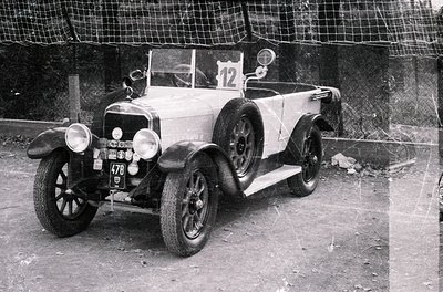 Vintage open-top touring car, likely a 1920s French Citroën Type A, marked with race number "12" and license plate "478." Woo...