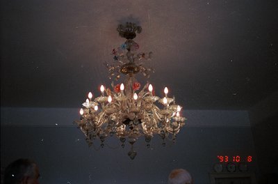 Vintage chandelier with 16 candle-style bulbs, ornate brass detailing, and floral motifs, likely from a 1970s–1980s European ...