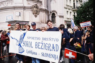 Group of cheerful participants in a 1990s Ljubljana parade, holding a banner for *Sokół Bezigrad* sports club (Ljubljana, Slo...