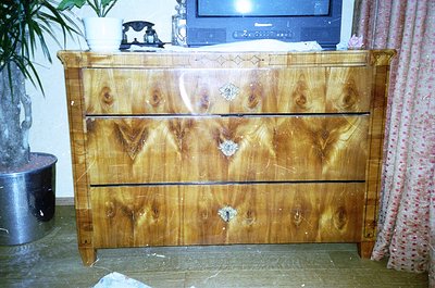 Mid-century modern wooden dresser with three drawers, featuring light oak or birch veneer with visible wood grain and subtle ...