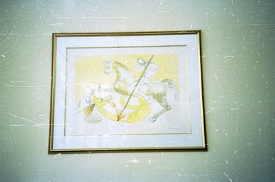 Abstract ink-and-watercolor composition featuring dynamic, organic forms in muted yellows and whites. Central vertical line c...