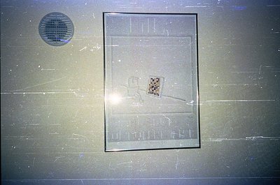 Vintage glass plaque featuring a stylized skier with a checkered flag, likely commemorating alpine sports. Engraved text read...