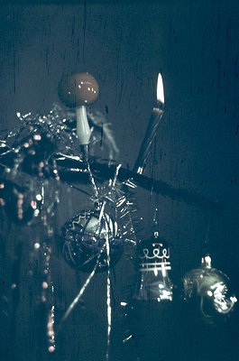 Vintage glass chandelier with intricate Art Nouveau-style metalwork, featuring ornate floral and geometric motifs. Warm candl...