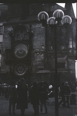 Vintage black-and-white photo of Prague’s Astronomical Clock tower (Orloj) with medieval architecture and ornate astronomical...