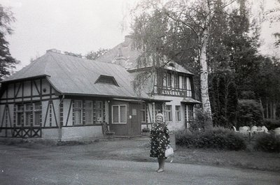 Black-and-white photo of a timber-framed building labeled "АВАНА" (Avana) in Cyrillic, likely a 1960s-70s seaside resort in B...