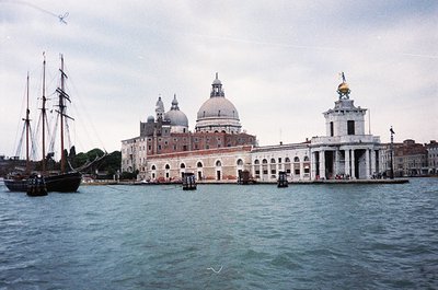 Historic Venetian waterfront featuring the **San Giorgio Maggiore** church with its iconic domes and classical façade. A trad...