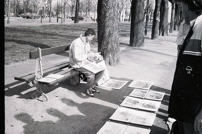 Mid-century urban park scene: man seated on bench reading newspaper, surrounded by checkered pavement tiles. Classic 1960s st...
