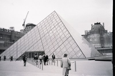 Iconic glass pyramid entrance of the **Louvre Museum**, Paris, France. Constructed by I.M. Pei in 1989, blending modernist de...
