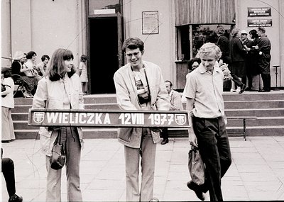 Black-and-white snapshot from **Wieliczka Salt Mine, Poland, 1977**. Three tourists pose with a sign marking the date and loc...