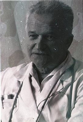 Portrait of an elderly man in a white lab coat, likely a doctor, with stethoscope draped around his neck. The vintage sepia t...
