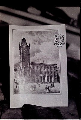 Vintage postcard featuring a grand 19th-century European clock tower with Gothic Revival architecture. Symmetrical facade wit...