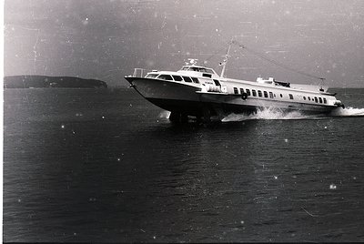Mid-20th century ferry cutting through choppy waters, likely a coastal route. Sleek, utilitarian design with visible "Sofia" ...