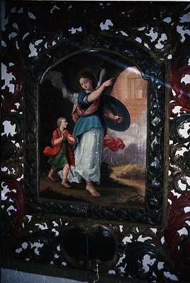 Religious icon depicting an angel (left) and a child (right) in Baroque-style attire, framed in ornate gilded metalwork. The ...