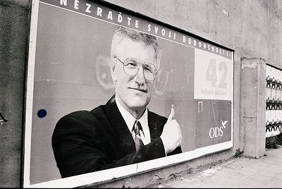 Vintage political campaign poster featuring a man in a suit, gesturing with his right hand. Text in Czech: *"Nezraďte svoji b...