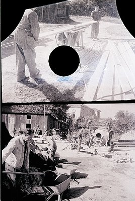 Black-and-white vintage construction site featuring manual labor in the early-to-mid 20th century. Workers in overalls and ca...