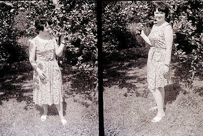 Two women in 1950s-style floral dresses pose outdoors on a grassy path. Left: short-sleeved dress with geometric patterns, ho...