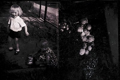 Vintage black-and-white photo of a young girl in a backyard, mid-1960s. She wears a short-sleeved blouse, shorts, and sandals...