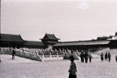 Vintage black-and-white photo of traditional East Asian palace architecture with upturned eaves and tiled roofs, likely or -i...