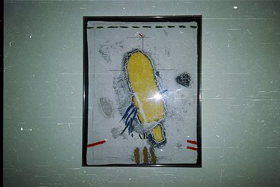 Vintage framed map or architectural diagram depicting a yellow-roofed, elongated structure with blue accents, likely a buildi...