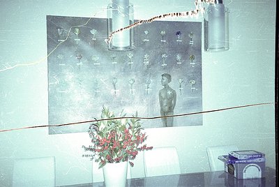 Vintage mural depicting a nude male figure surrounded by stylized tree illustrations, likely from a Soviet-era public buildin...