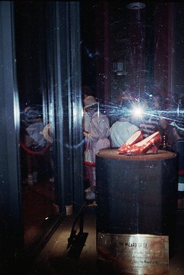 Vintage theatrical display of Dorothy’s iconic ruby slippers from *The Wizard of Oz* (1939), showcasing intricate craftsmansh...