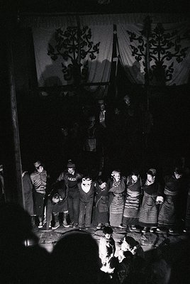 Vintage group performance in traditional folk attire, likely Eastern European (1960s–70s). Men in dark suits with hats, women...