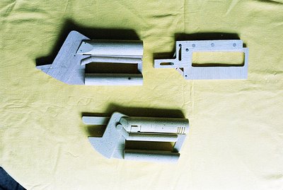 Industrial metal brackets with angled, bolted joints—likely for structural or mechanical assembly. Appears mid-20th century, ...