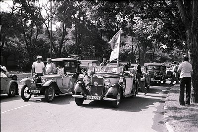 Vintage road rally featuring classic cars from the 1930s–1940s, including a vintage Mercedes-Benz 320 with visible license pl...