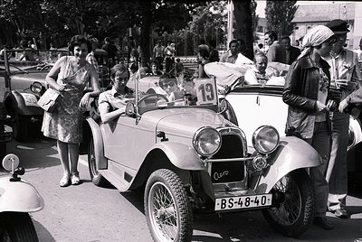 Classic vintage car (BS-48-40) with open-top design and dual headlamps, likely a 1930s–1940s European model, parked in a mid-...