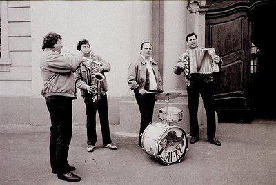 Street jazz quartet in mid-performance, 1960s–1970s. Saxophonist, accordionist, drummer (with Cyrillic "ЦЕР" on drum), and co...