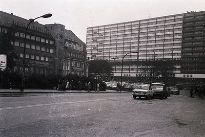 Mid-20th century urban scene featuring **Kreissparkasse** (regional savings bank) building with classic German signage. Crowd...