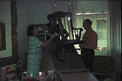 Vintage indoor scene featuring a woman in a striped dress and a man in a military uniform playing a vintage upright piano. De...