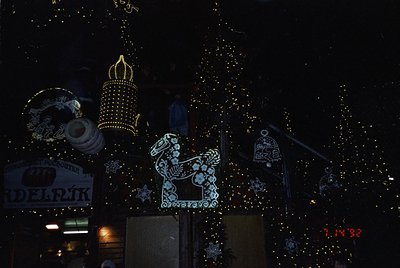 Decorative nighttime display featuring illuminated folk-art lanterns and horse silhouette. Intricate embroidered patterns and...