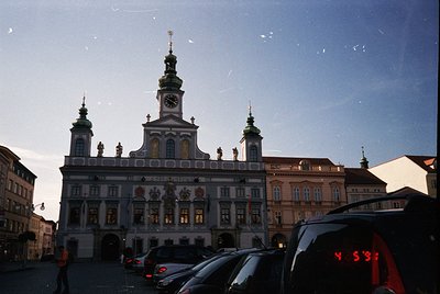 Baroque-style town hall with ornate façade, featuring a central clock tower and sculptural details. Symmetrical windows and d...